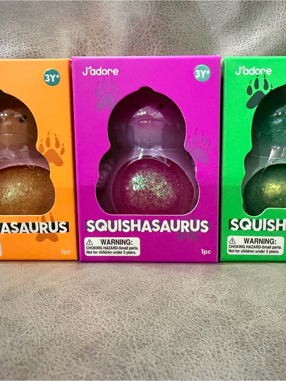 J’Adore Squishasaurus 3 pack- orange, purple, green. New in Box.